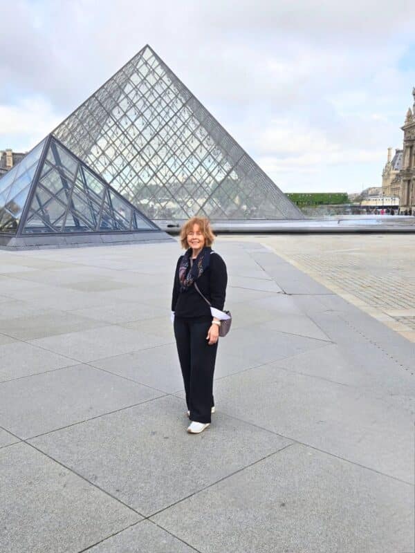 Louvre museum courtyard with glass pyramids