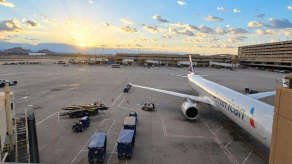 Airplane at gate at sunrise