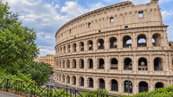 Rome Colosseum view with tourists and greenery