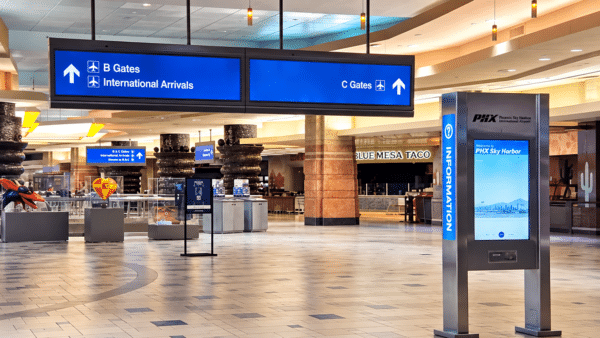 Airport layovers - Signs for airport gates inside Phoenix Sky Harbor terminal